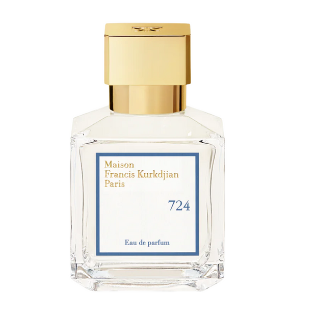 A clear glass bottle of 724 Maison Francis Kurkdjian Eau de parfum with a gold-colored cap.