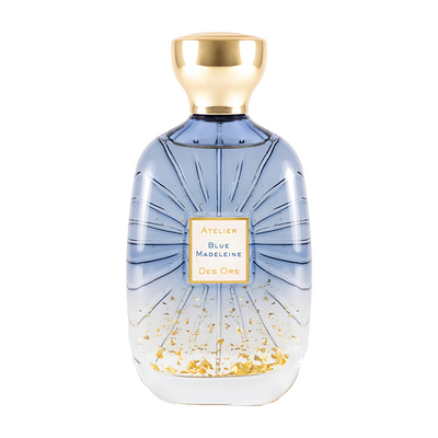 Blue Madeleine Perfume bottle with gold cap and decorative label on a white background