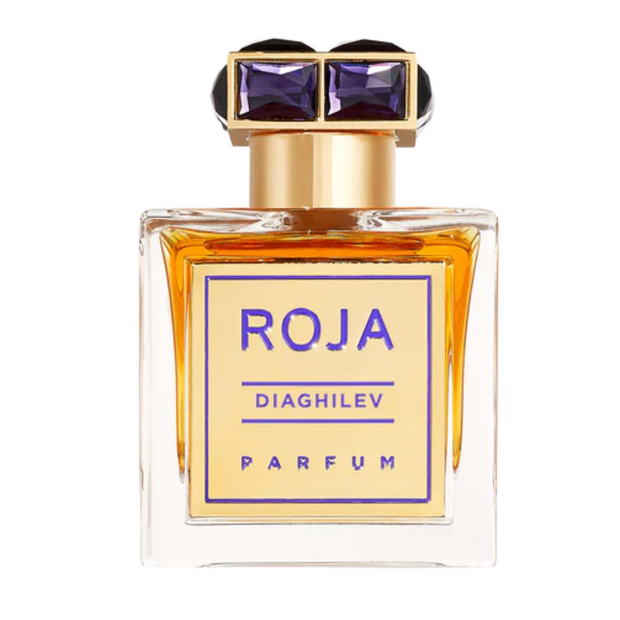 Diaghilev Roja Dove A square-shaped perfume bottle with a clear glass body and a gold-colored cap with purple gemstones. The label displays the brand name 'ROJA' and the word 'DIAGHILEV' in purple letters.