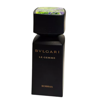 A black bottle of Bvlgari Le Gemme KOBRAA Eau De Parfum for men with a colorful floral cap.