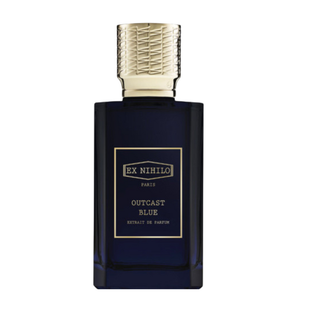 A dark blue perfume bottle with gold-colored cap, labeled 'EX Nihilo PARIS OUTCAST BLUE EXTRAIT DE PARFUM'.