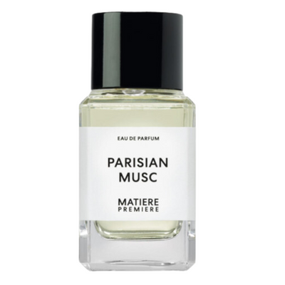A bottle of Parisian Musc Matiere Premiere eau de parfum, clear glass with a black cap and white label.