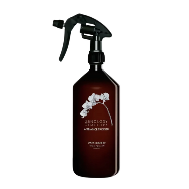 ROOM SPRAY ORCHIDACEAE A brown room spray bottle with a label featuring white orchids and the brand name ZENOLOGY.