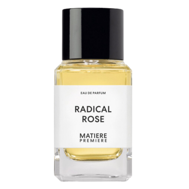 A glass bottle of Matiere Premiere Radical Rose eau de parfum with a black cap and a white label.