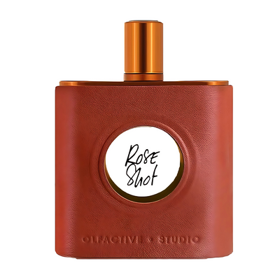 Rose Shot Olfactive Studio Brown leather-textured perfume bottle with gold cap on a white background