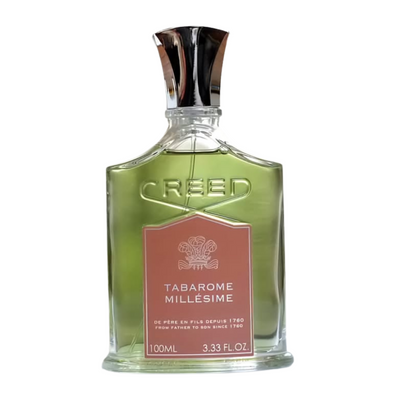 A bottle of Tabarome Millesime Creed fragrance for men with a green label and a metallic cap.