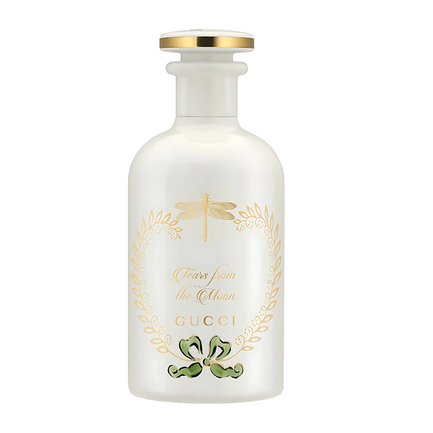 Tears From The Moonn Gucci perfume bottle with gold accents on a white background