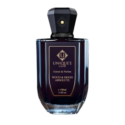 A bottle of 'Unique'f Woud & Mood Absolute Tester perfume for men and women, with a dark tinted liquid and a black label.